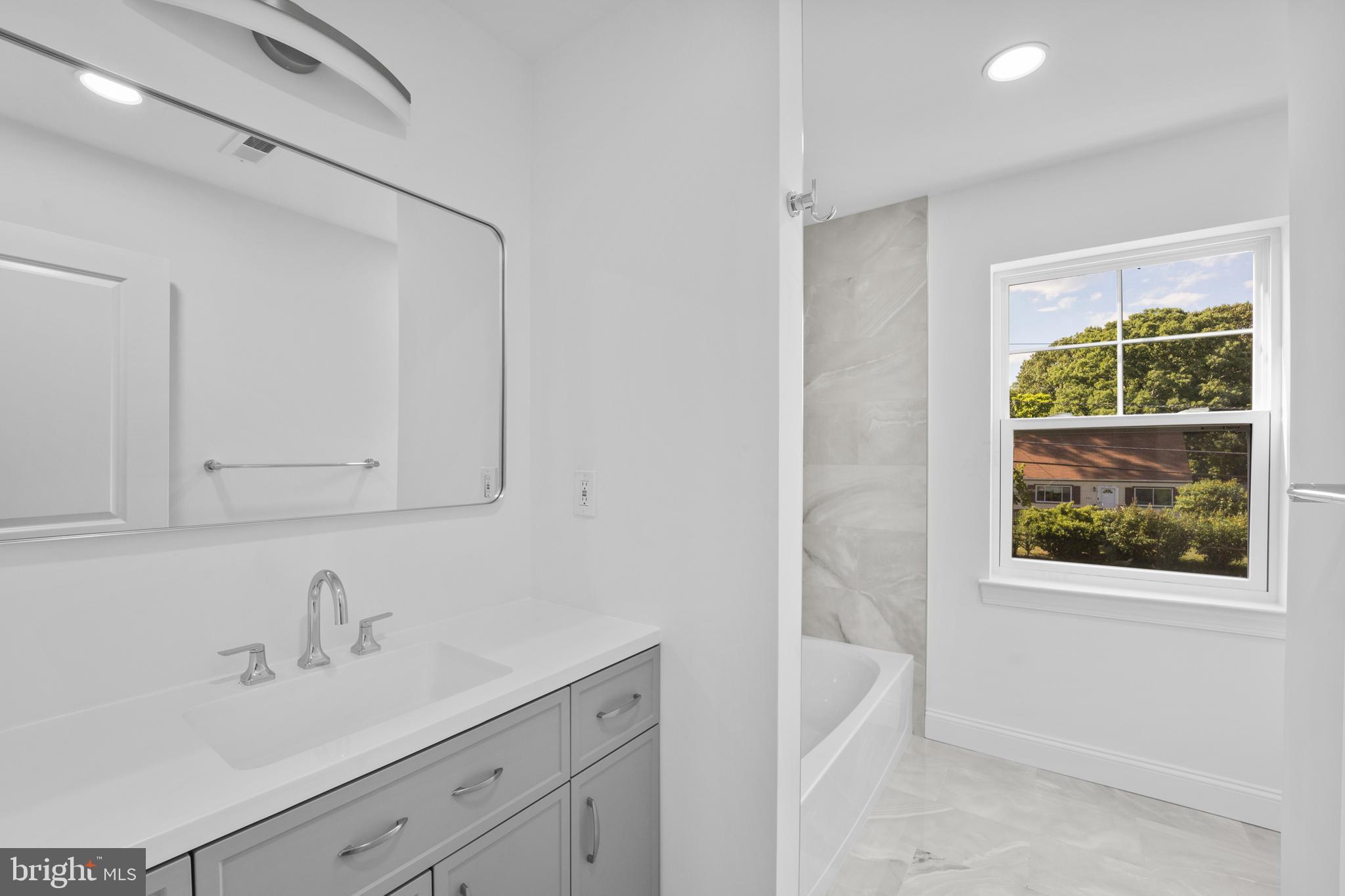 492 Ellis Avenue Lawnside, NJ 08045 - Photo 22 of 33 a bathroom with a sink and a bathtub