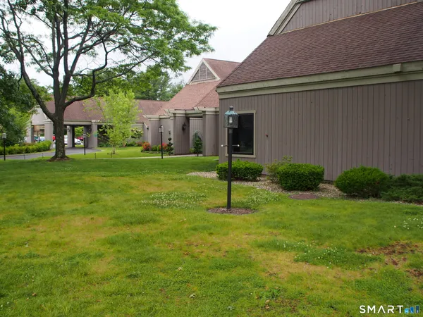 a view of a swimming pool and lounge chairs