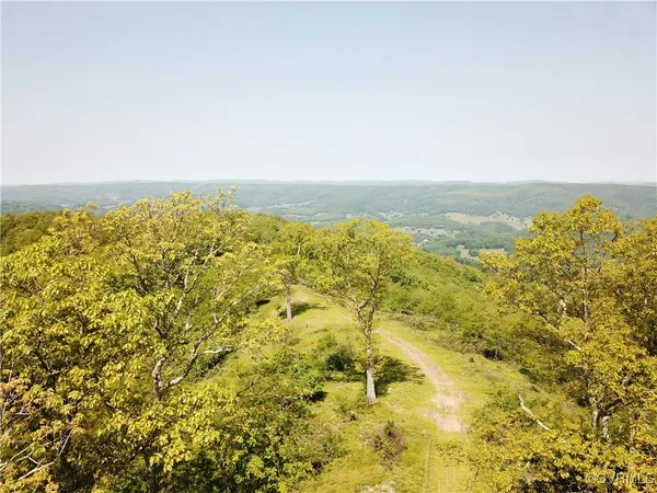 a view of an ocean from a mountain