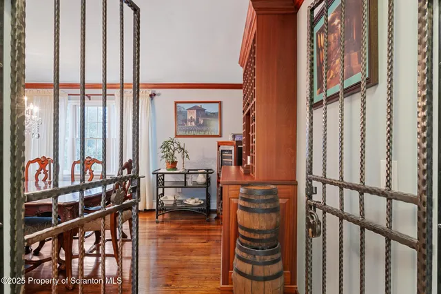 a view of a dining room with furniture wooden floor and chandelier