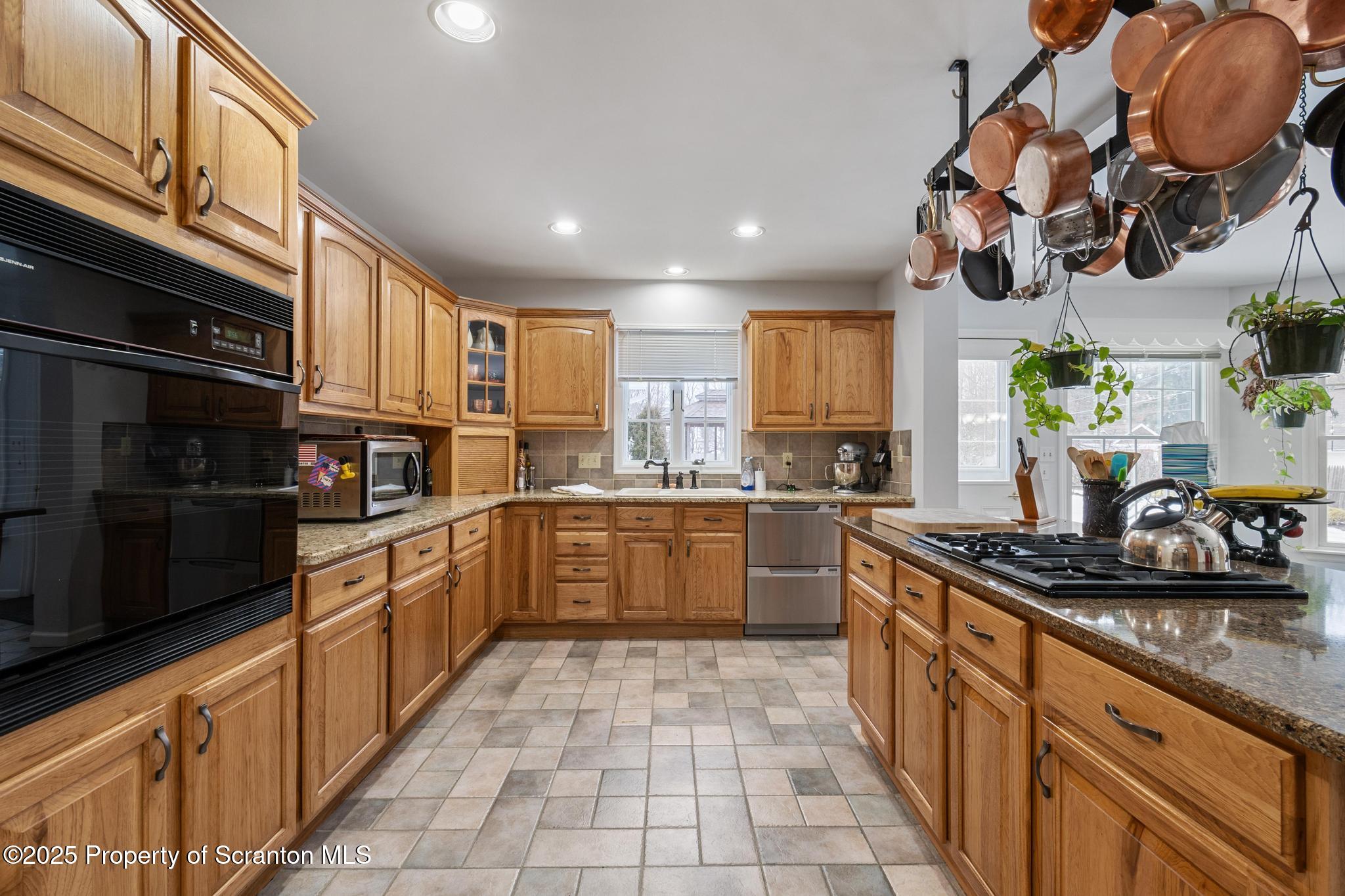 321 North Abington Road Clarks Green, PA 18411 - Photo 14 of 78 a kitchen with stainless steel appliances granite countertop a sink and cabinets