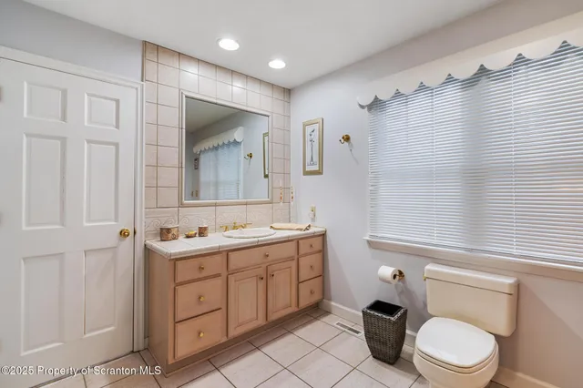 a bedroom with a bed and a dresser in it