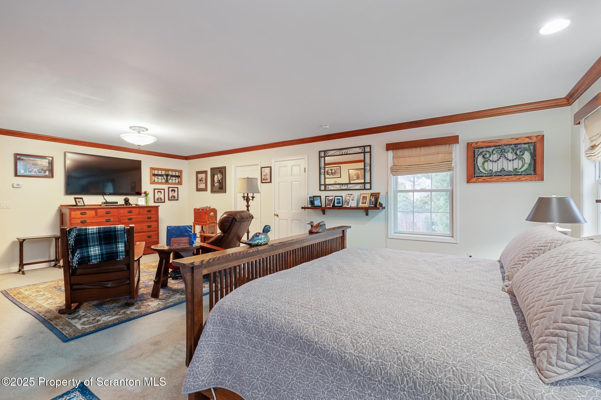 321 North Abington Road Clarks Green, PA 18411 - Photo 25 of 78 a bedroom with furniture and a flat screen tv