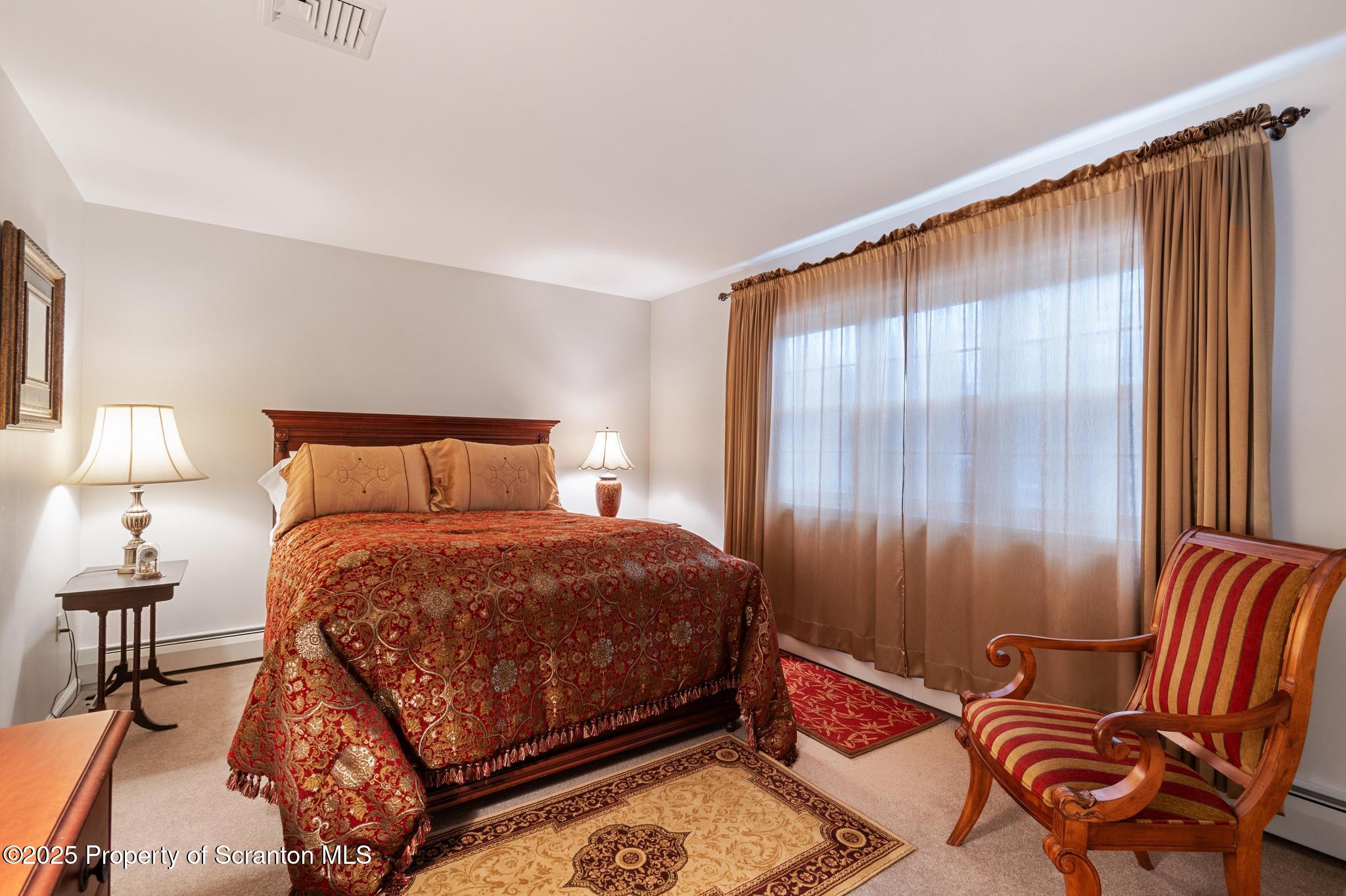 321 North Abington Road Clarks Green, PA 18411 - Photo 30 of 78 a bedroom with a bed and lamp