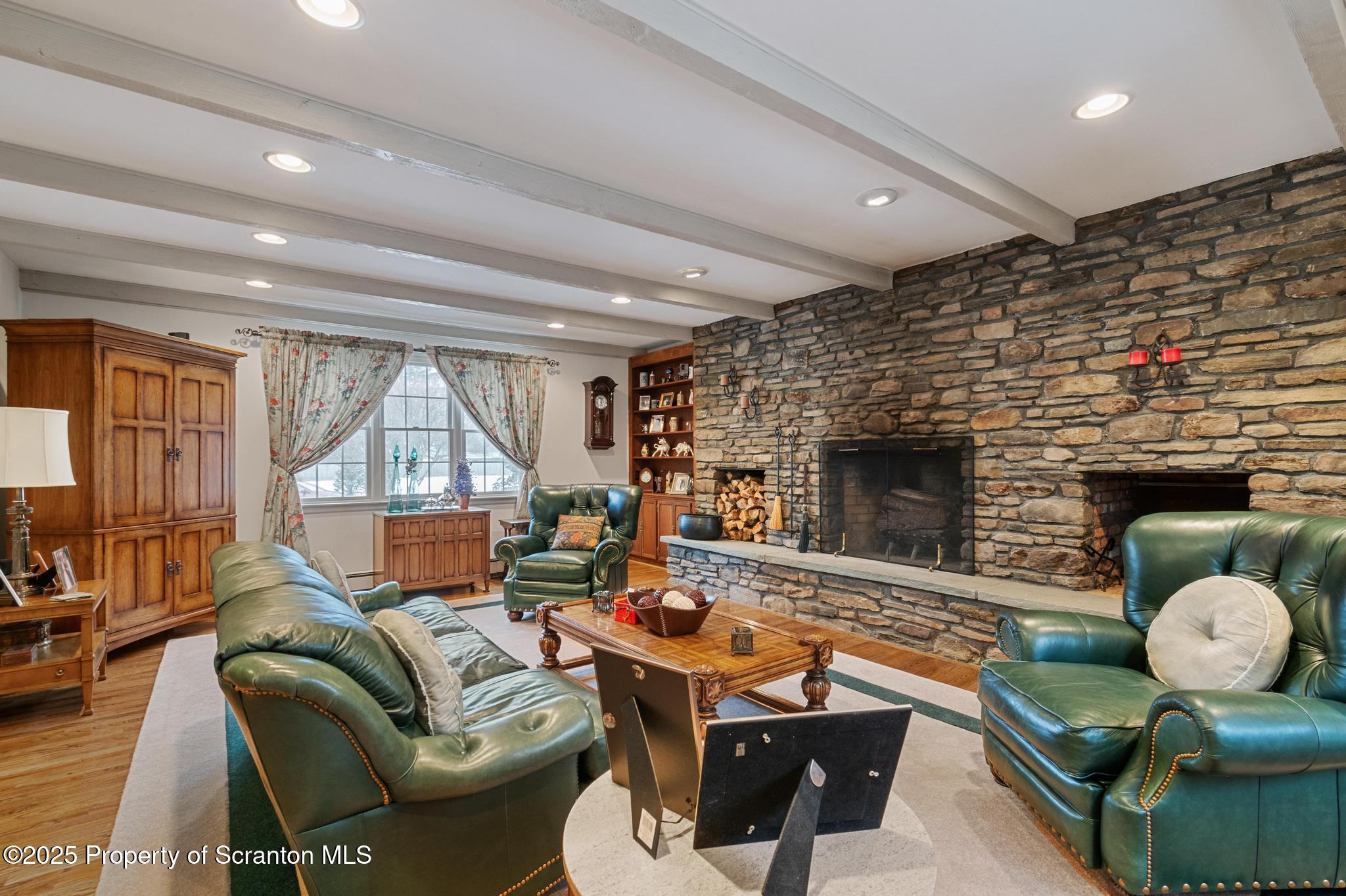 321 North Abington Road Clarks Green, PA 18411 - Photo 3 of 78 a living room with furniture fireplace and a large window