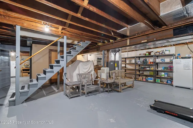 a front view of a house with a yard table and chairs
