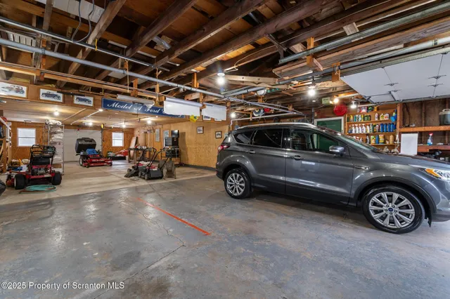 a view of a backyard with plants and patio