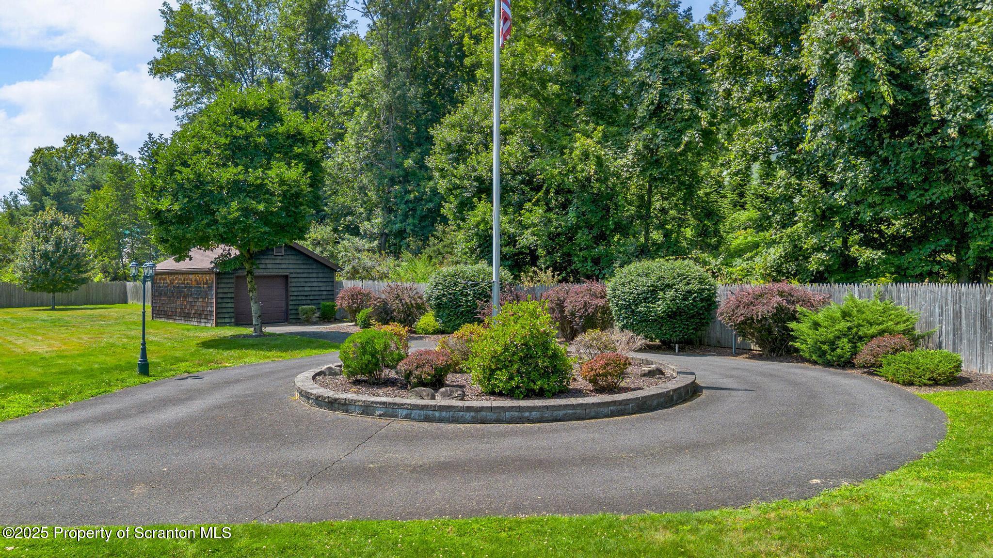 321 North Abington Road Clarks Green, PA 18411 - Photo 69 of 78 a view of a garden with a fountain