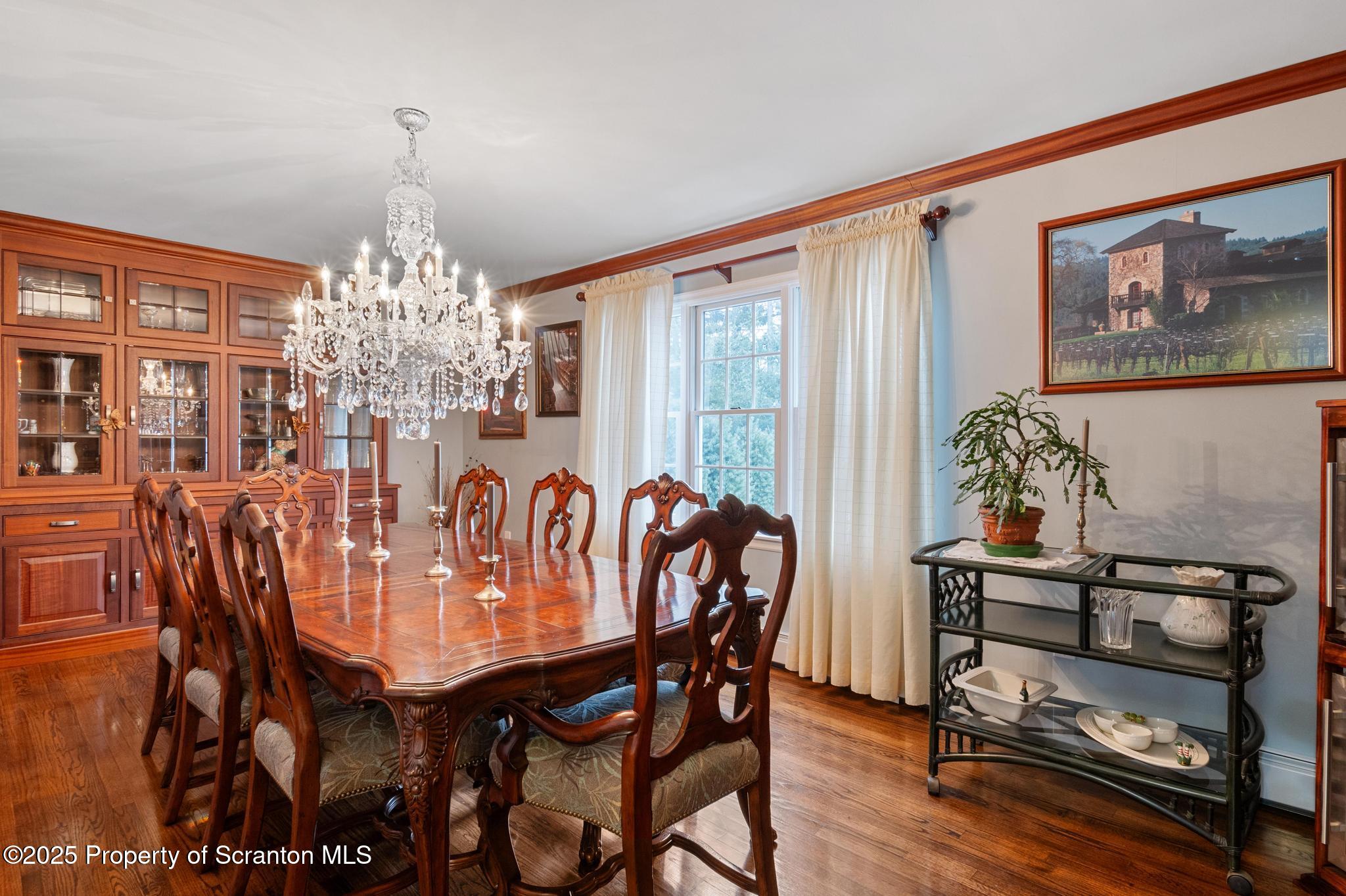 321 North Abington Road Clarks Green, PA 18411 - Photo 9 of 78 a view of a dining room with furniture wooden floor and chandelier