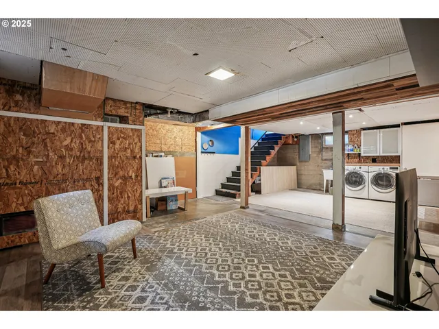 a living room with furniture and a rug