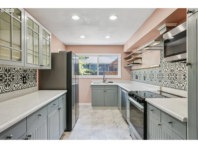 a kitchen with a sink stove and refrigerator