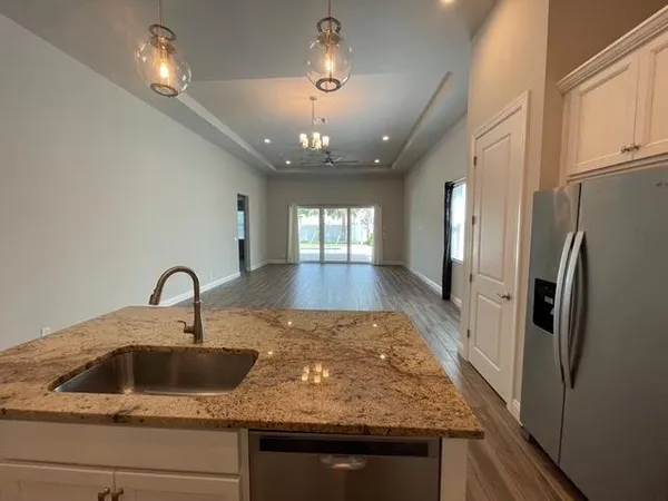 a large bathroom with a large tub and sink