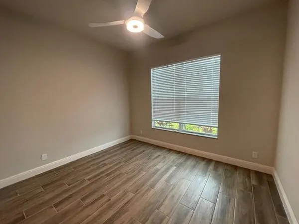 a room with gym equipment and a large window