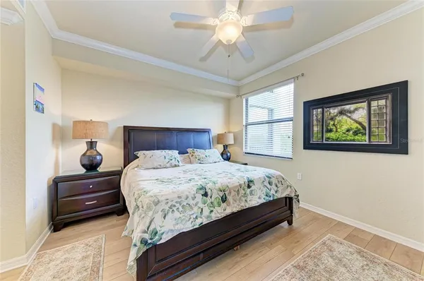 a bedroom with bed and a window