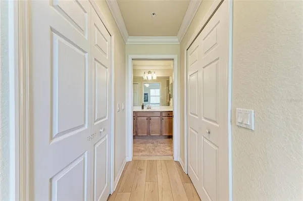 a view of a hallway with a dining room