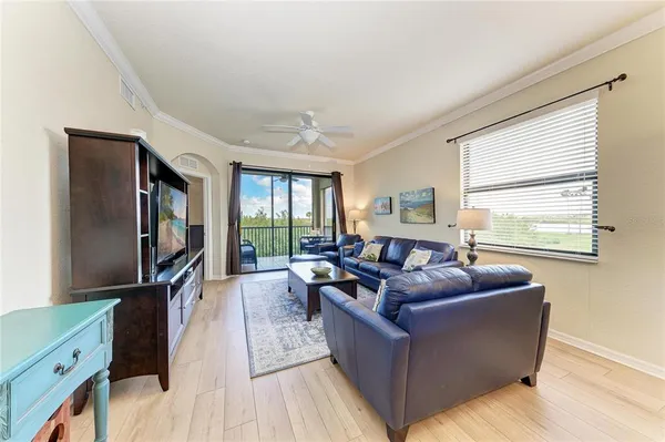 a living room with furniture and a large window
