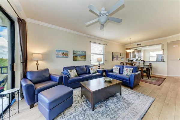 a living room with furniture or couch and a wooden floor