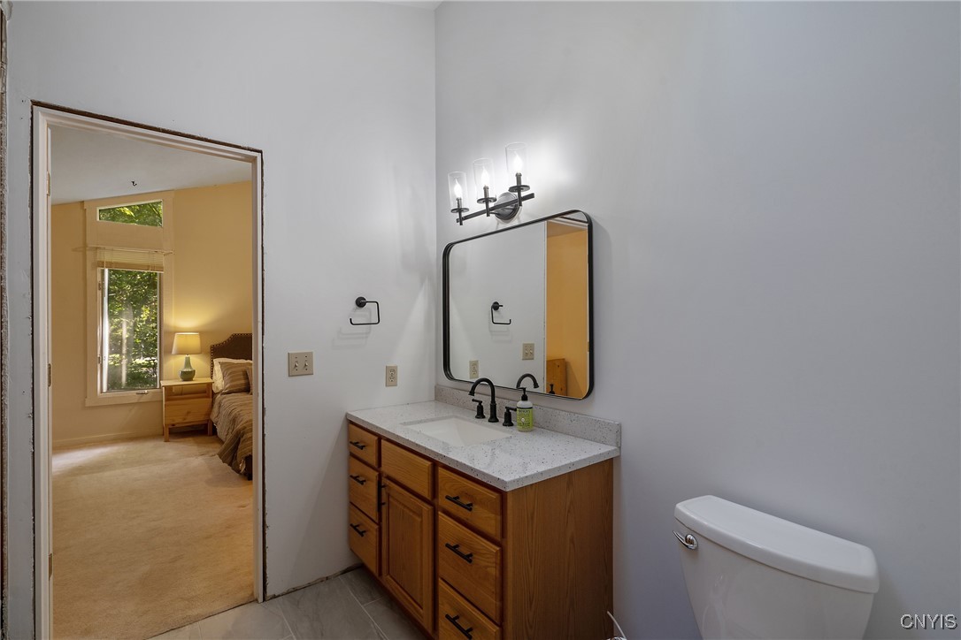 8734 Radburn Drive Lysander, NY 13027 - Photo 24 of 40 Remodeled upper level full bathroom has new cerami