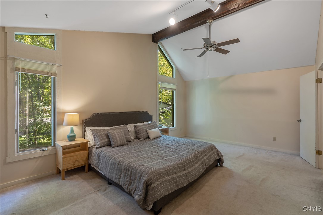 8734 Radburn Drive Lysander, NY 13027 - Photo 28 of 40 Primary BR also has wood beam ceiling and track li