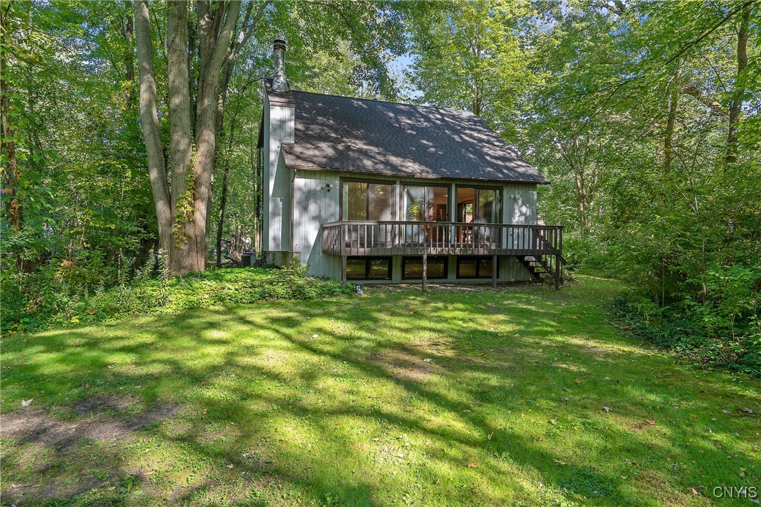 8734 Radburn Drive Lysander, NY 13027 - Photo 35 of 40 Back view of the home with deck and three sliding