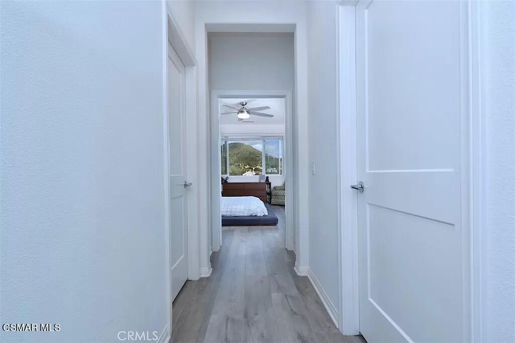 207 Morro Way, Unit 3 Simi Valley, CA 93065 - Photo 18 of 31 a view of a hallway with wooden floor and bedroom