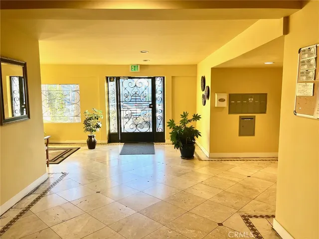 a view of a entryway door with wooden floor