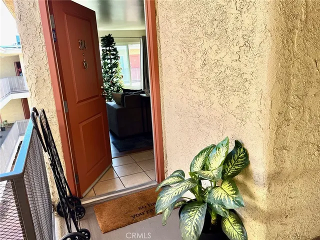a vase of flowers sitting on a floor