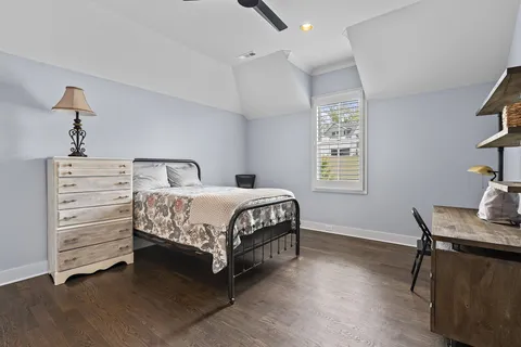 a bedroom with a bed and a table in it