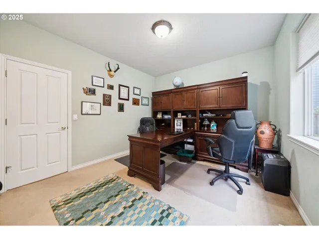 a view of a workspace with furniture