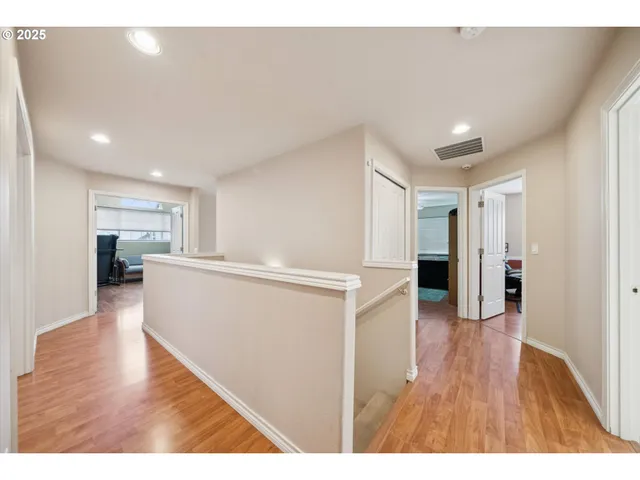 a view of a living room and wooden floor