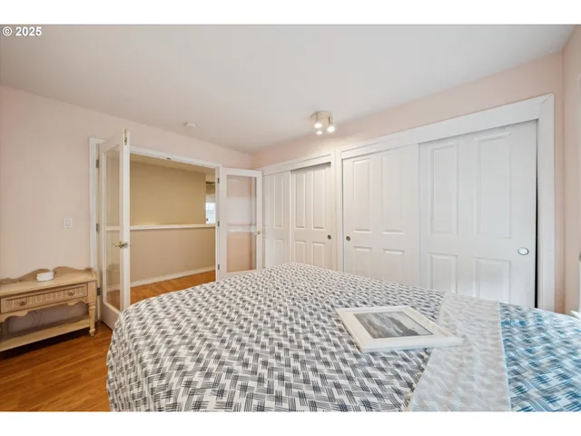a bedroom with a bed and a cabinets