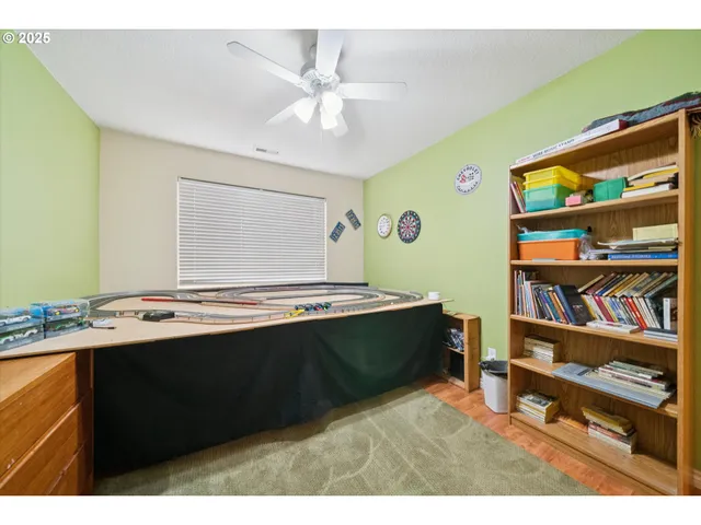 a kitchen with stainless steel appliances granite countertop a sink dishwasher and a black stove with cabinets