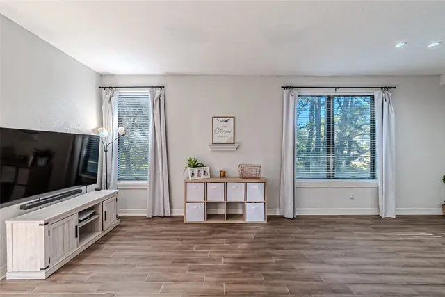 a view of living room with furniture and flat screen tv