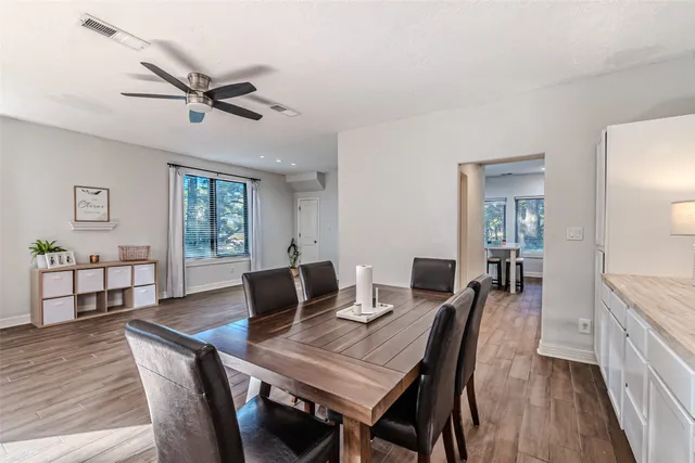a view of a dining room with furniture window and wooden floor