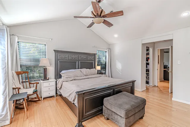 a bed room with a bed and a chandelier