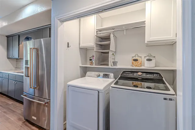 a kitchen with a stove and a refrigerator