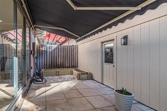 a view of a door and chair in balcony