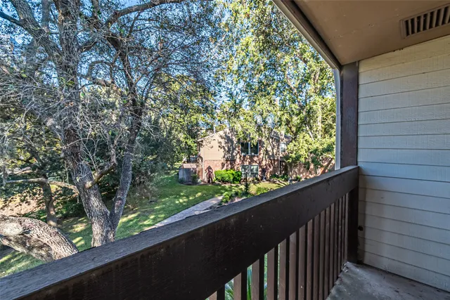 a view of a garden from a balcony