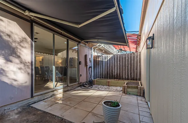 a backyard of a house with yard and outdoor seating