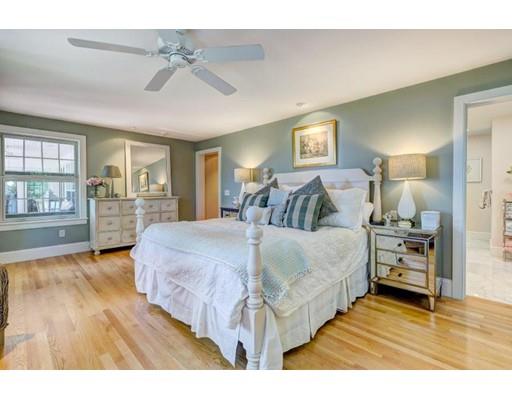 646 South Orleans Road Orleans, MA 02653 - Photo 21 of 42 a spacious bedroom with a bed and wooden floor