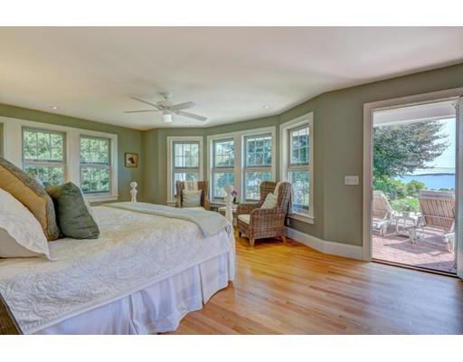646 South Orleans Road Orleans, MA 02653 - Photo 22 of 42 a bedroom with a large bed and wooden floor