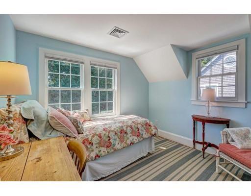 646 South Orleans Road Orleans, MA 02653 - Photo 30 of 42 a bedroom with a bed and wooden floor