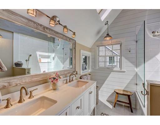 646 South Orleans Road Orleans, MA 02653 - Photo 32 of 42 a bathroom with a sink double vanity and a mirror