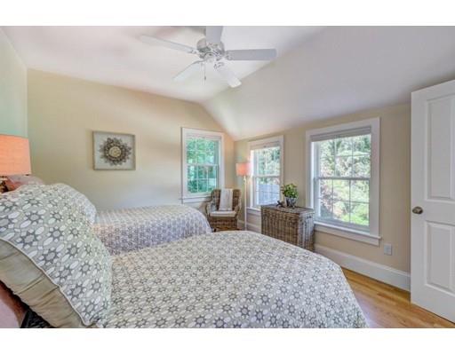 646 South Orleans Road Orleans, MA 02653 - Photo 39 of 42 a bedroom with a large bed and a window