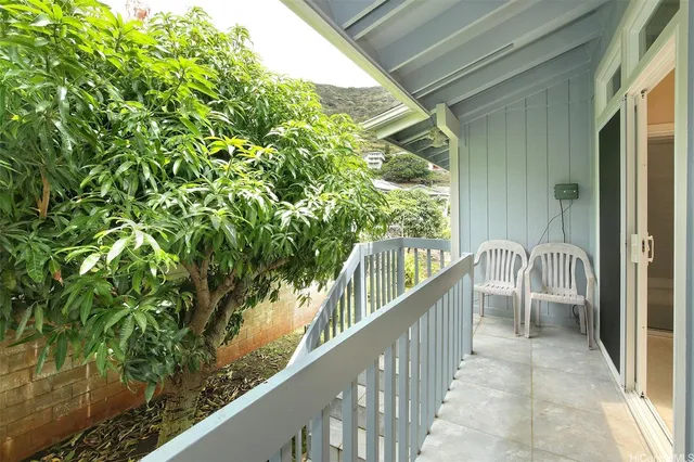 a view of balcony and yard