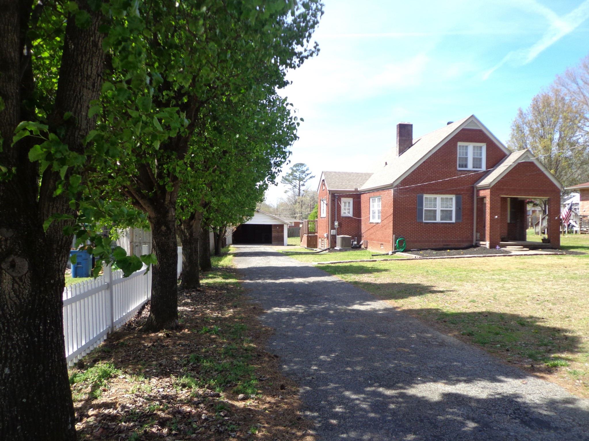 181 Washington Avenue Camden, TN 38320 - Photo 1 of 68 a front view of a house with a yard
