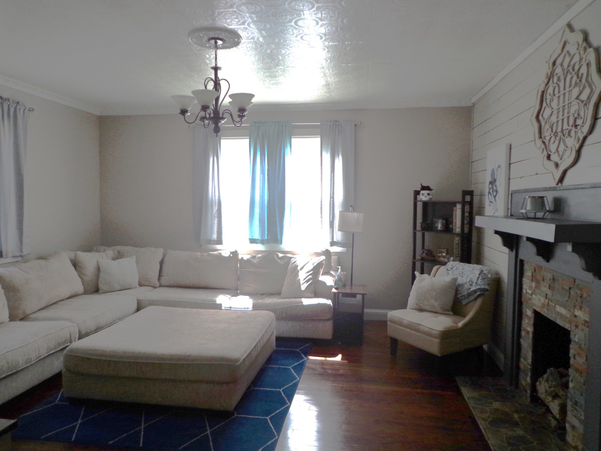 181 Washington Avenue Camden, TN 38320 - Photo 17 of 68 a living room with furniture and a chandelier