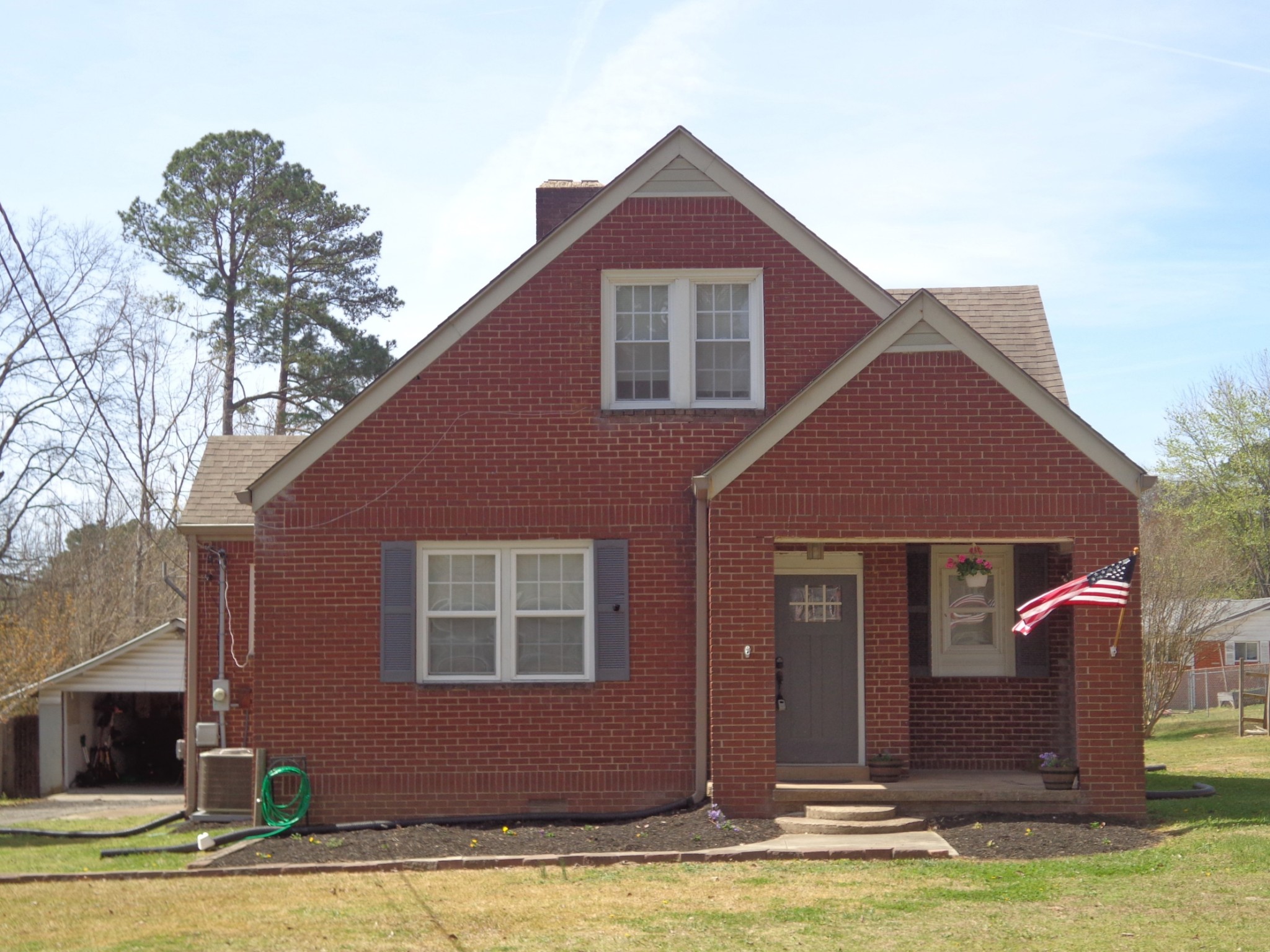 181 Washington Avenue Camden, TN 38320 - Photo 2 of 68 a front view of a house with a yard