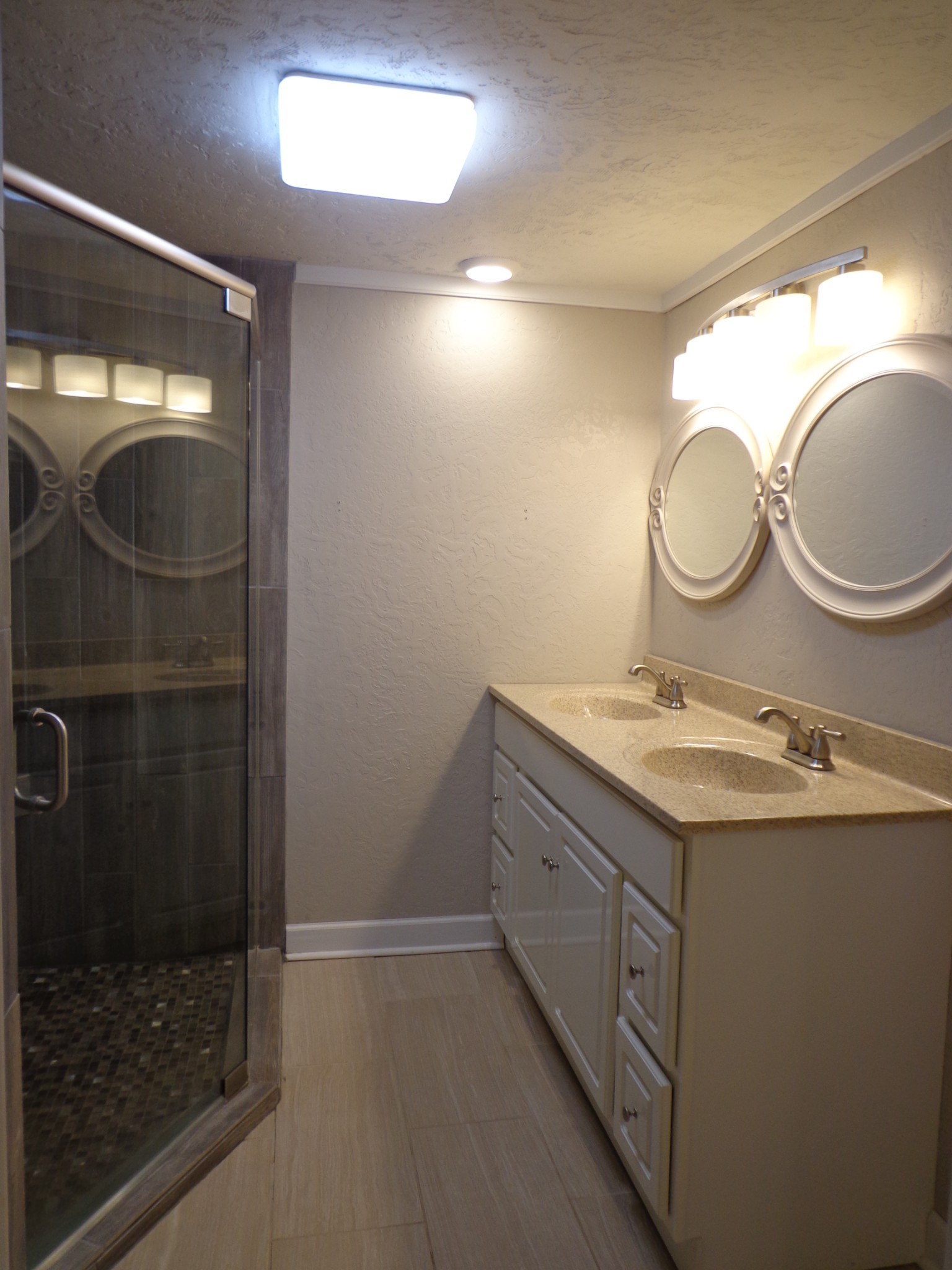 181 Washington Avenue Camden, TN 38320 - Photo 30 of 68 a bathroom with a granite countertop sink a toilet and a shower