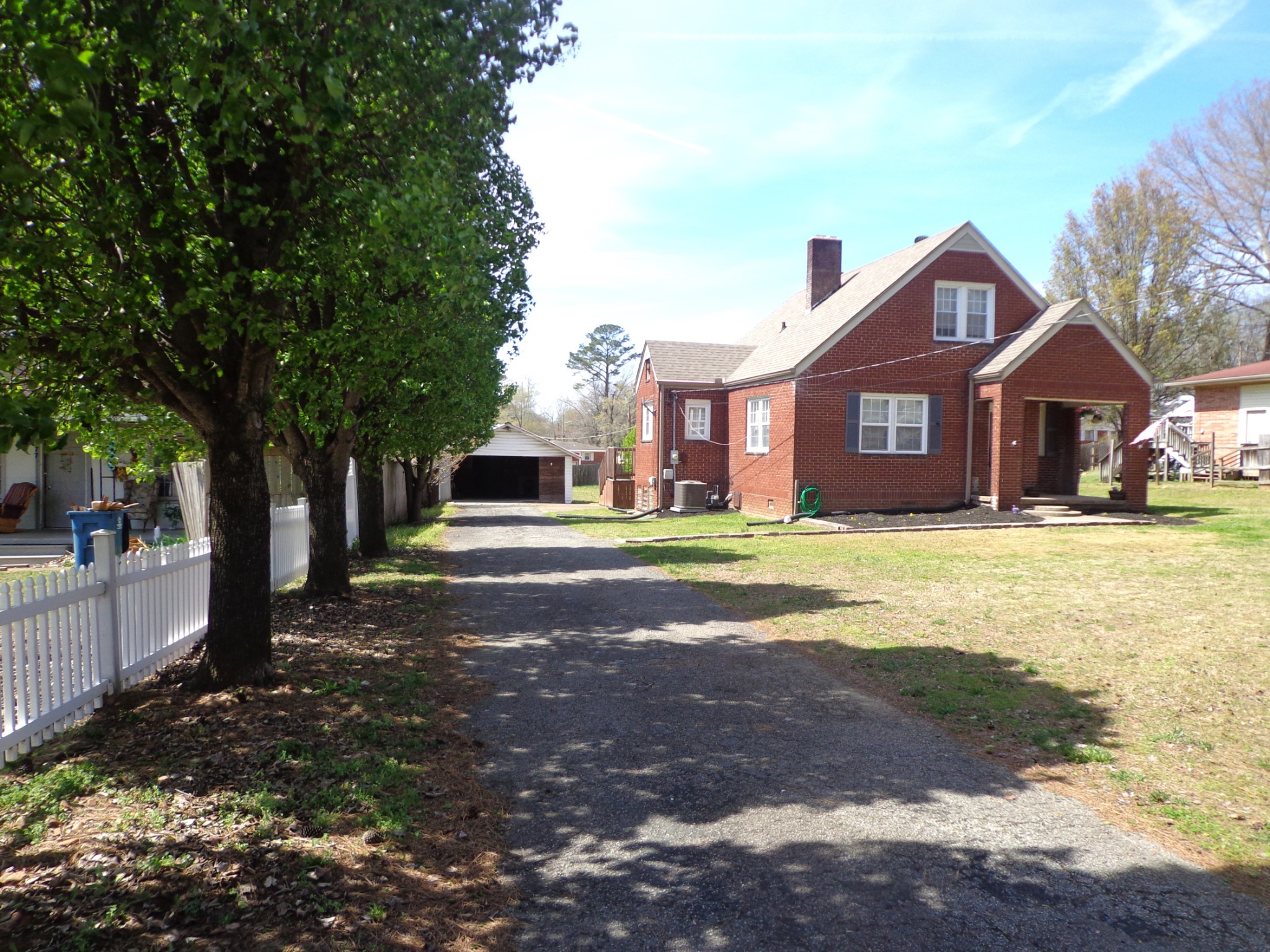 181 Washington Avenue Camden, TN 38320 - Photo 68 of 68 a front view of a house with a yard and trees